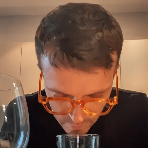 person wine glass transparent material