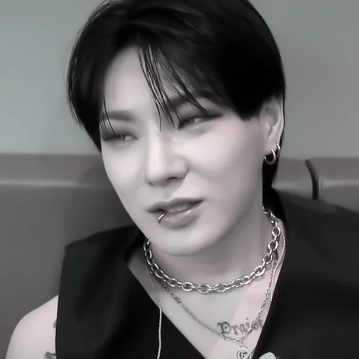 human face necklace person