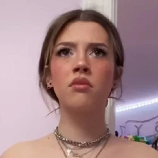 human face necklace person