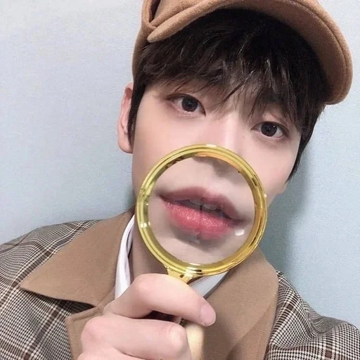 person hand glass human face