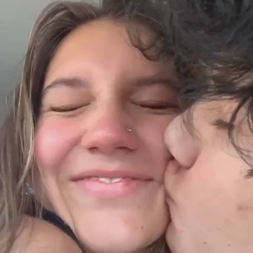 person kiss human face